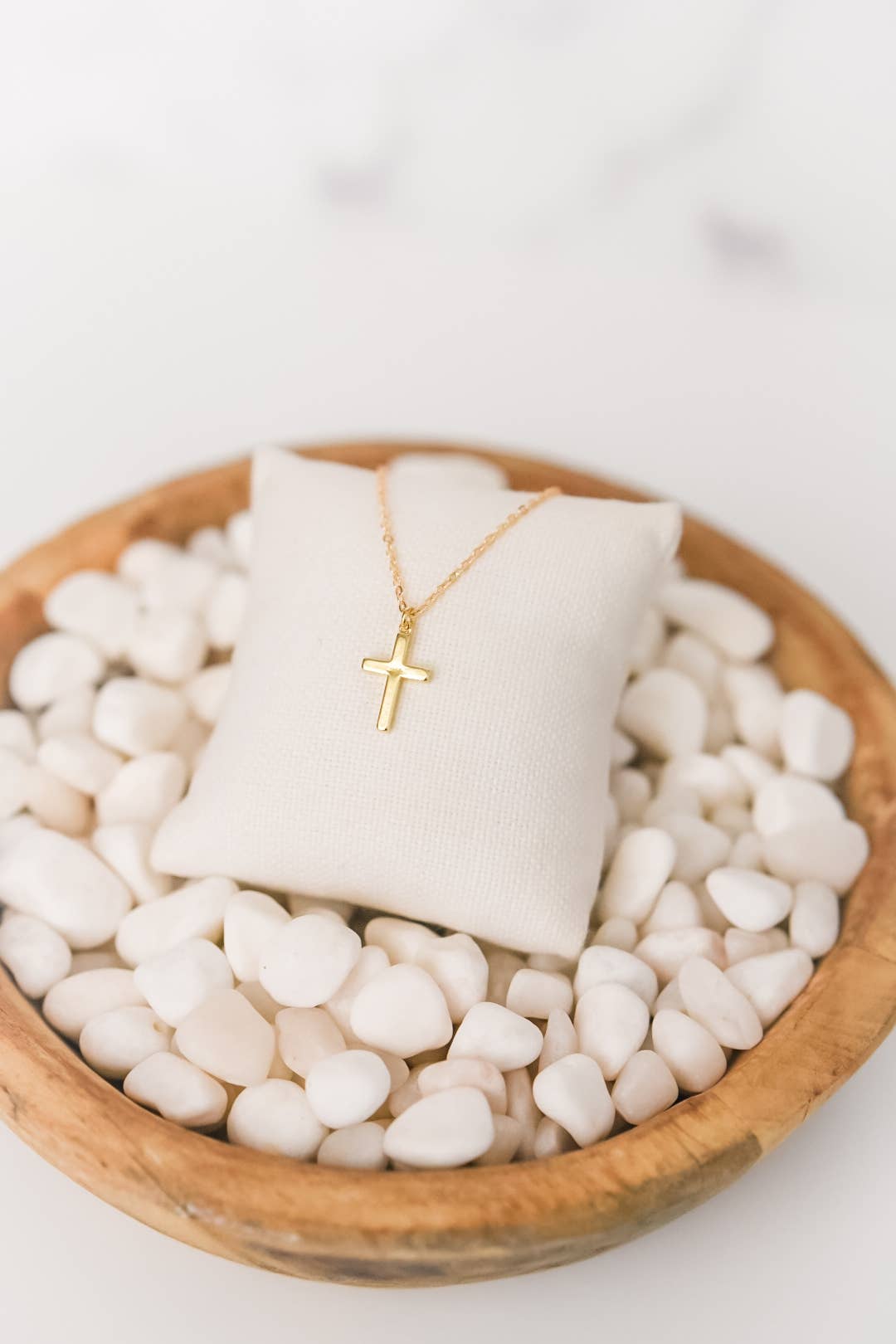 Gold-plated Bella Rey jewelry cross necklace with a delicate chain, designed in a classic cross pendant style.