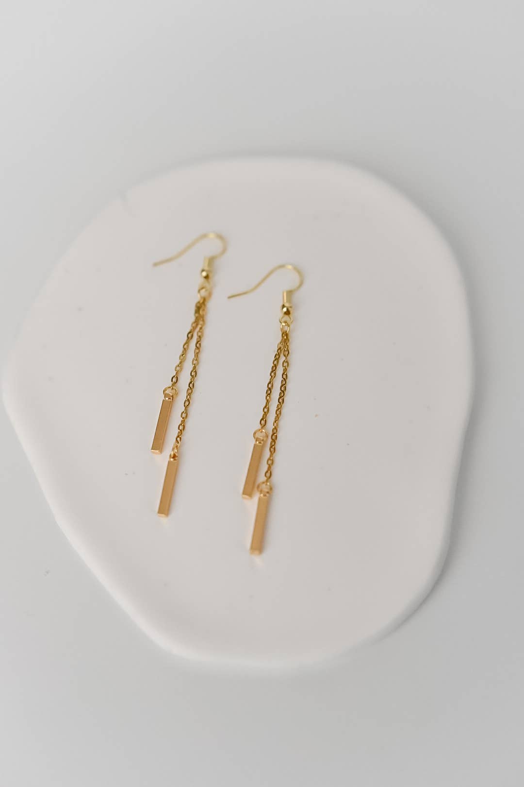 Gold plated Sierra dainty chain earrings by Bella Rey Jewelry, featuring delicate chain design and elegant craftsmanship.