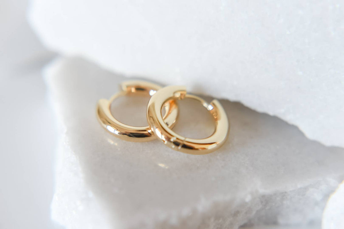 Bella Rey Jewelry 18k gold chunky hoop earrings shown as a bold, polished hoop design