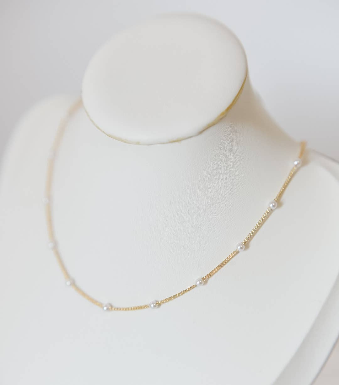 Bella Rey jewelry mini pearl beaded chain necklace on a clean background