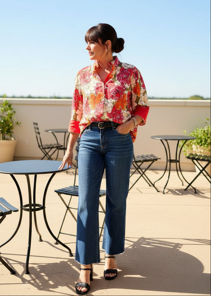 Red floral button-up top by Jodifl, featuring a vibrant pattern and lightweight fabric, shown on a model.
