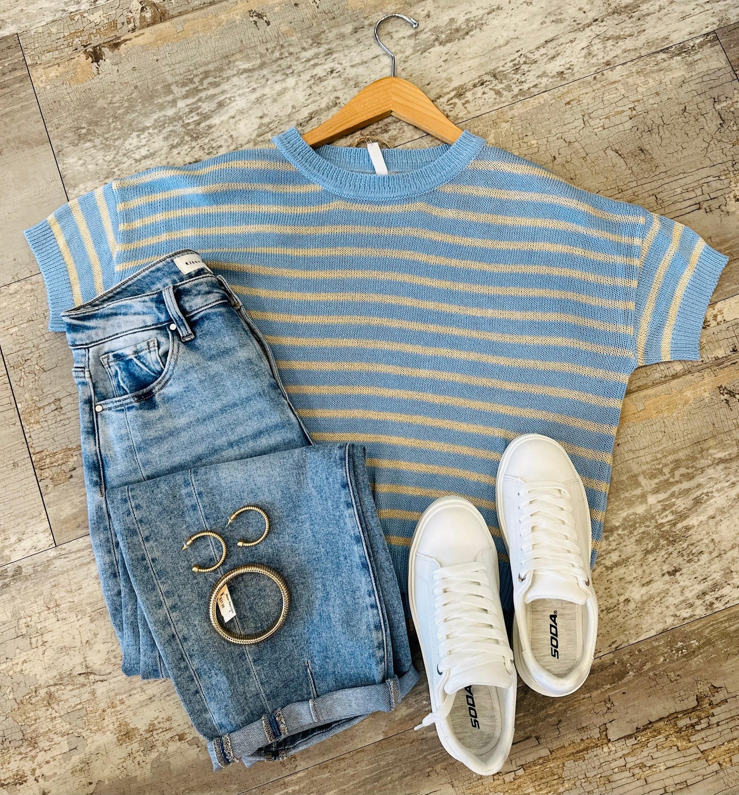 Must Have Striped Sweater Top – Lightweight short-sleeve striped sweater in sky blue and natural tones, featuring a semi-sheer design and classic round neckline. Perfect for casual and chic styling.