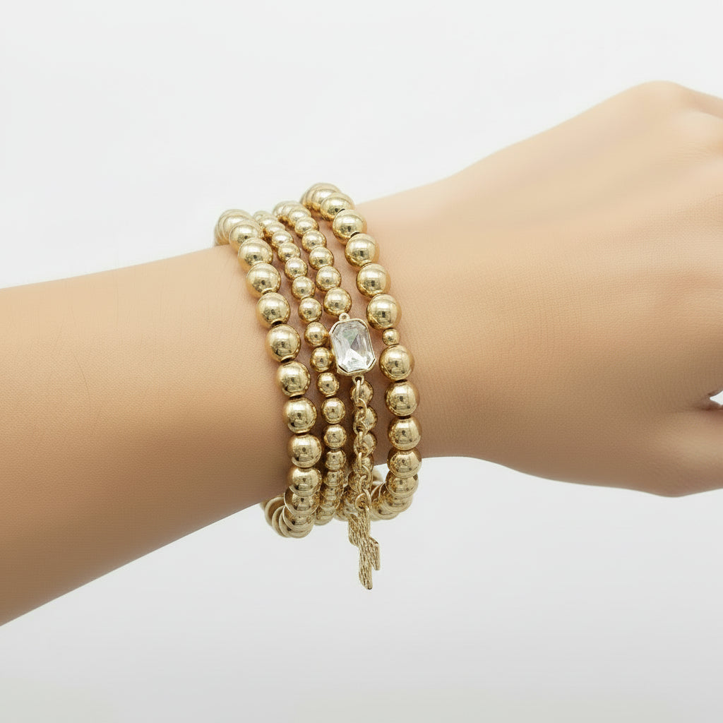 What's Hot - Water Resistant Set of 4 Gold and Cross Stretch Bracelets - Jolie Femme Boutique